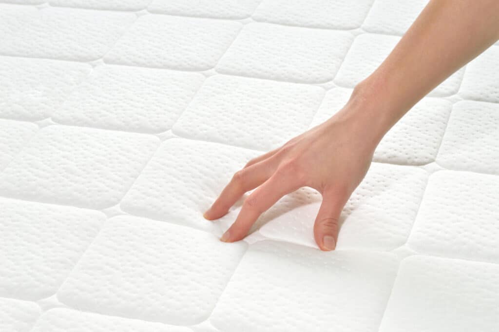 hand testing mattress firmness