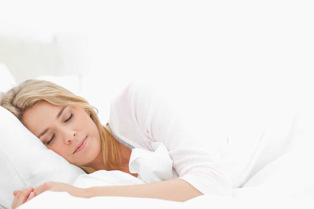 woman sleeping on mattress