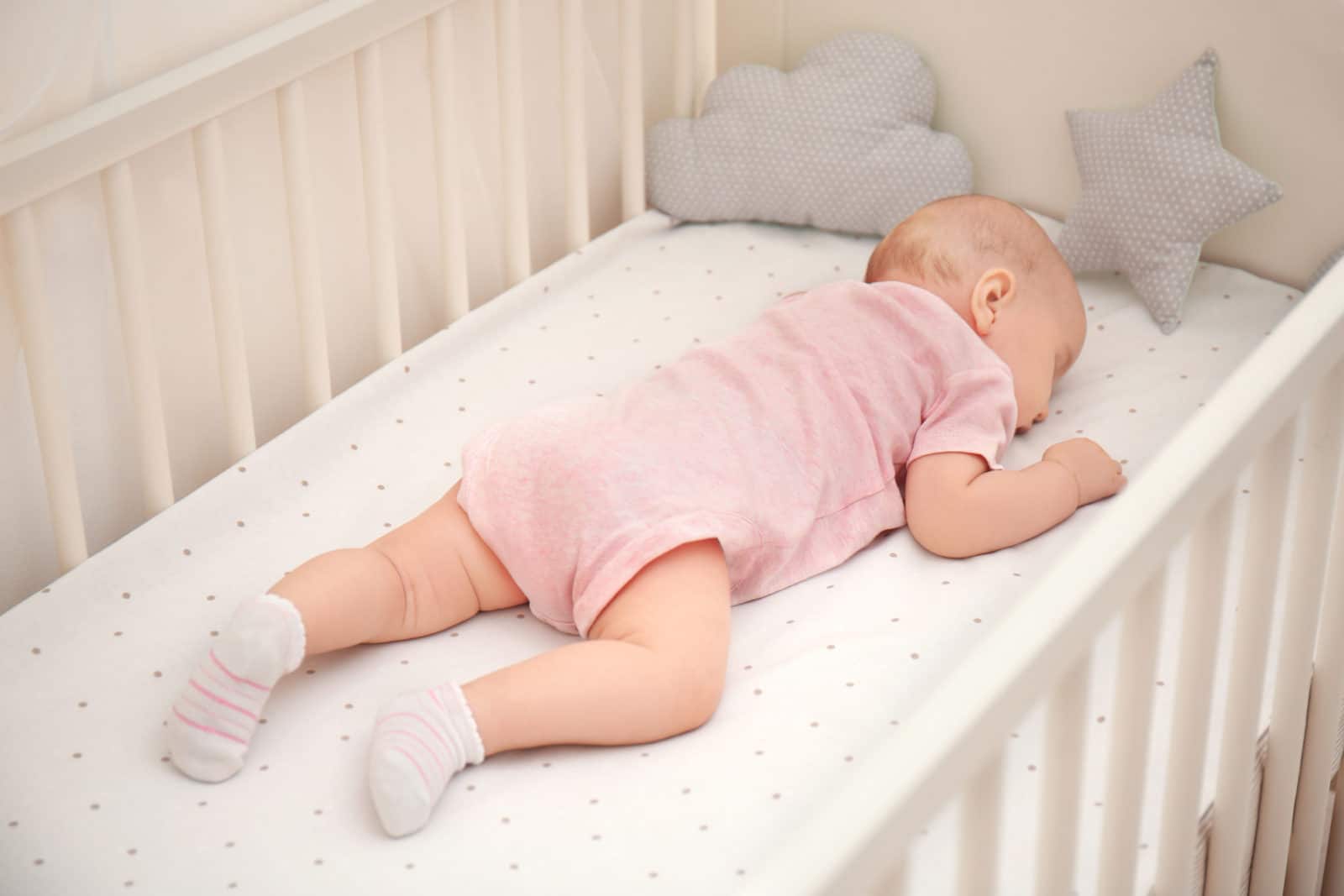 baby girl sleeping in a crib
