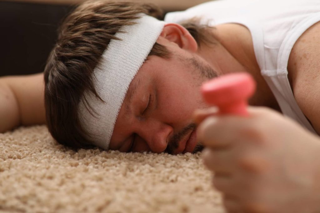 man sleeping after working out