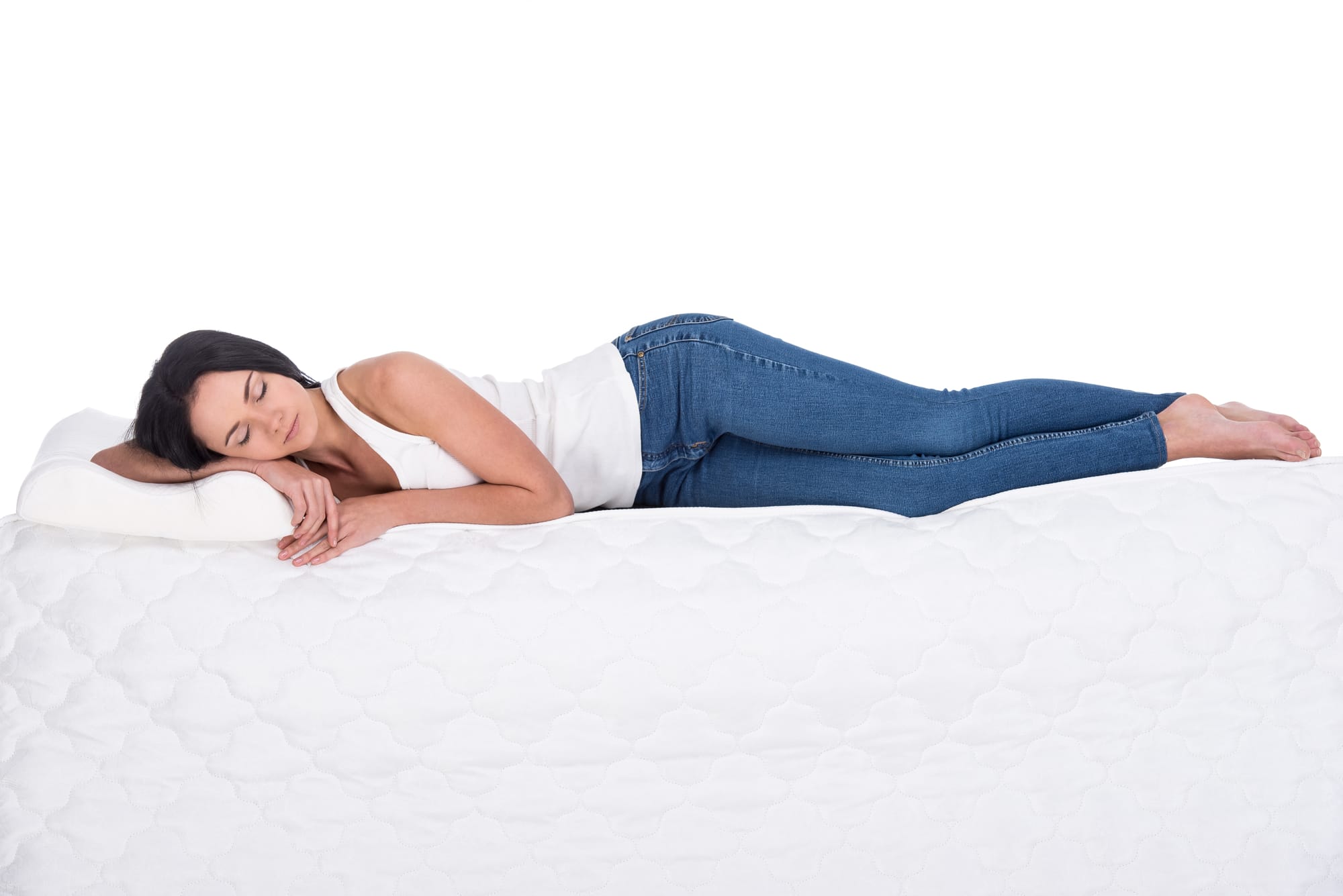 a woman sleeping on a mattress