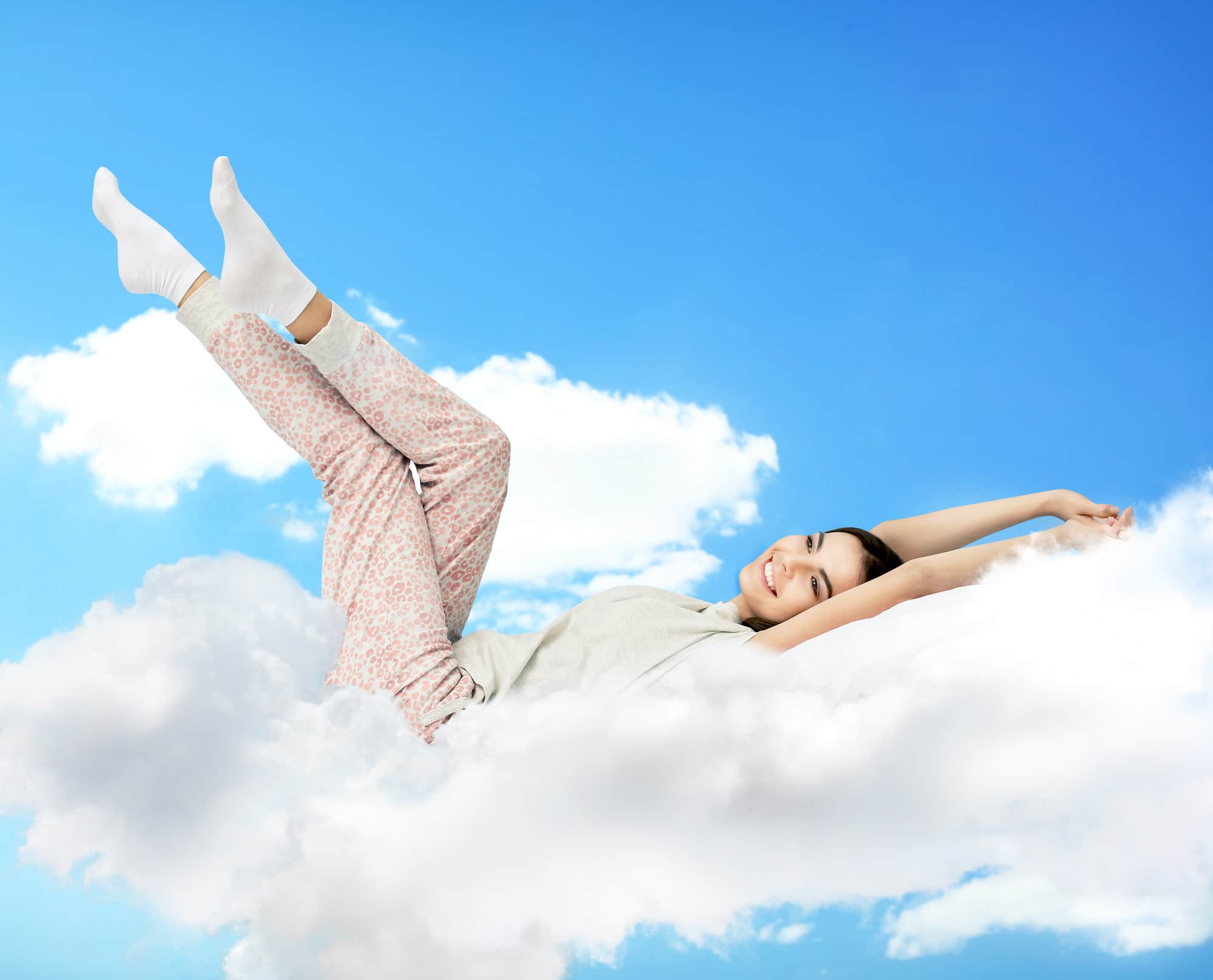 a girl lying on the cloud