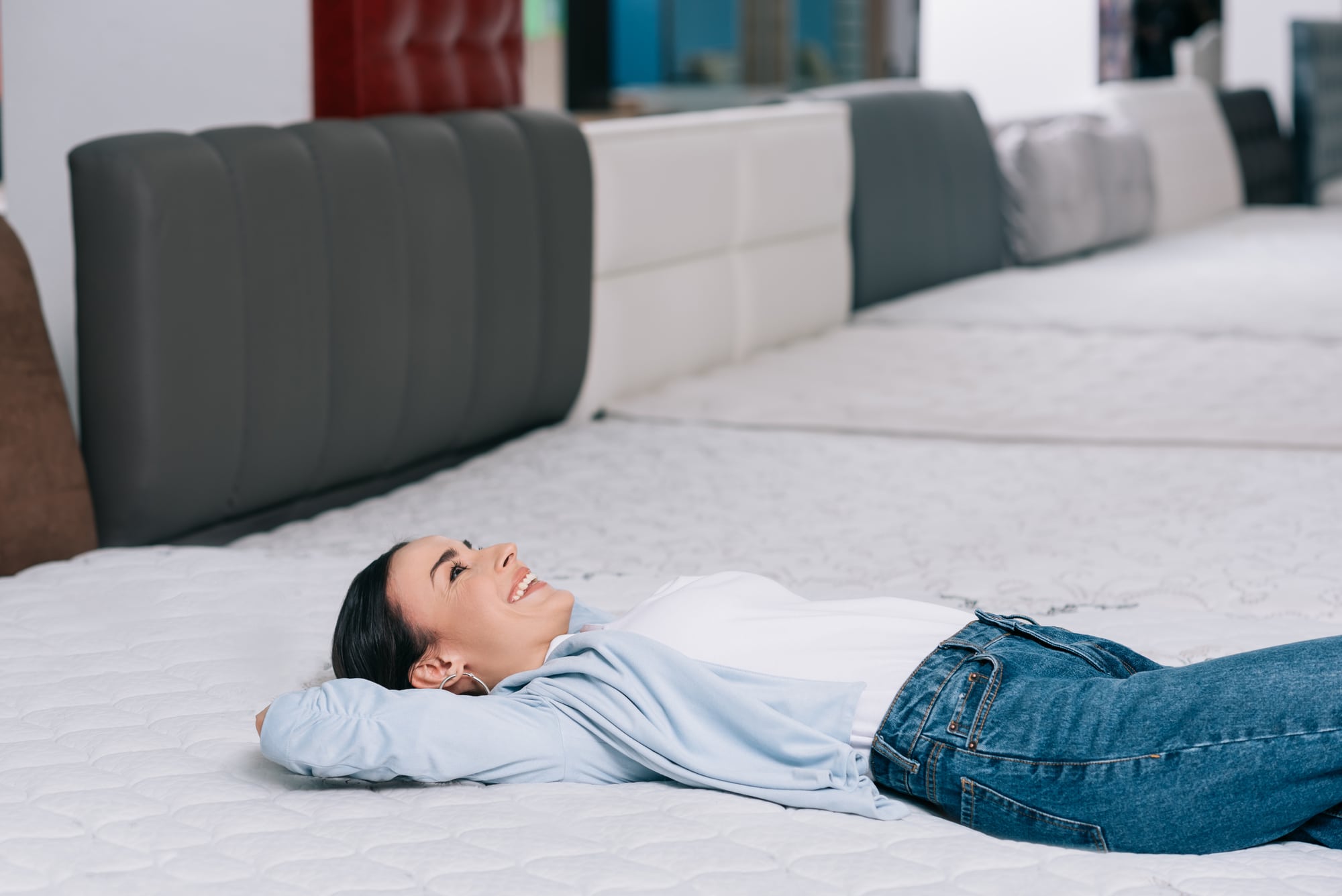 woman lying on mattress