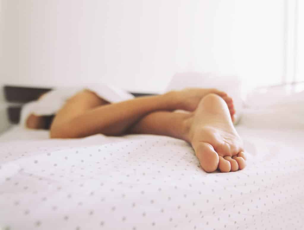 Feet of a sleeping woman