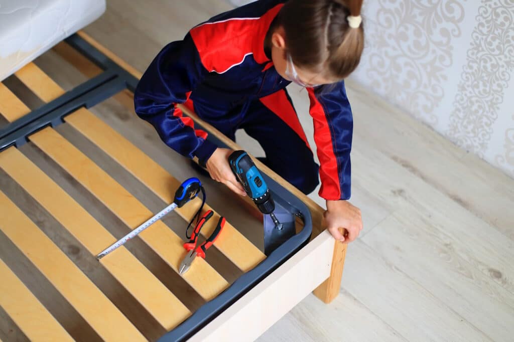 Fixing a bed frame with tools